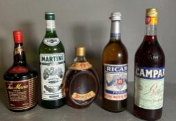 A selection of spirits: Bottle of Ricard, Dimple Scotch whisky, Campari, Martini Extra Dry, and