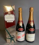 Two Bottles of Laurent Perrier Brut chmapgne one with a novelty label 'Merry Christmas from the