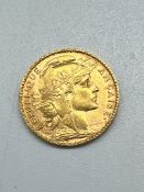 A 1905 French 20 Francs gold coin.