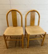 Two 80's style pine arched chairs