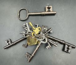 A set of antique keys , most on a key ring with a brass tag marked 4482 DUPE