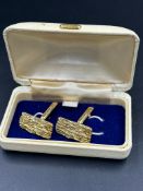 A pair of 9ct gold, cuff links with a bark design, hallmarked for London 1975 and with an