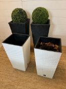 Four rattan planters, two black (H60cm) and two white (H50cm)