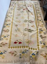 A large embroidery rug with cream grounds and floral stemmed flowers 380cm x 285cm