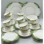 A part tea set of green and gilt pattern by Lawleys