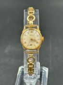 A Wolux 18ct gold ladies watch.