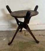 A carved African tripod coffee table (H45cm Dia50cm)