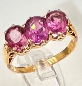 A pink three stone ring, size L, approximate weight 3.5g