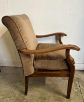 A Mid Century open arm chair upholstered in brown