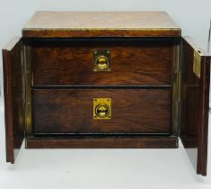A rosewood campaign style humidor box, the off set doors open to two drawers with adjustable