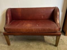 A two seater red leather bench seat with brass studded detail AF