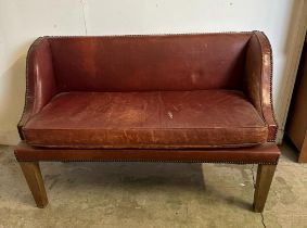 A two seater red leather bench seat with brass studded detail AF