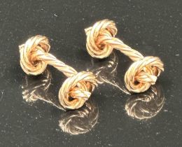 A pair of 9ct gold knot themed cuff links with a total approximate weight of 12.7g and a width of