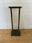 A green marble topped plant stand on brass fluted column supports on brass lions paw feet (H91cm)