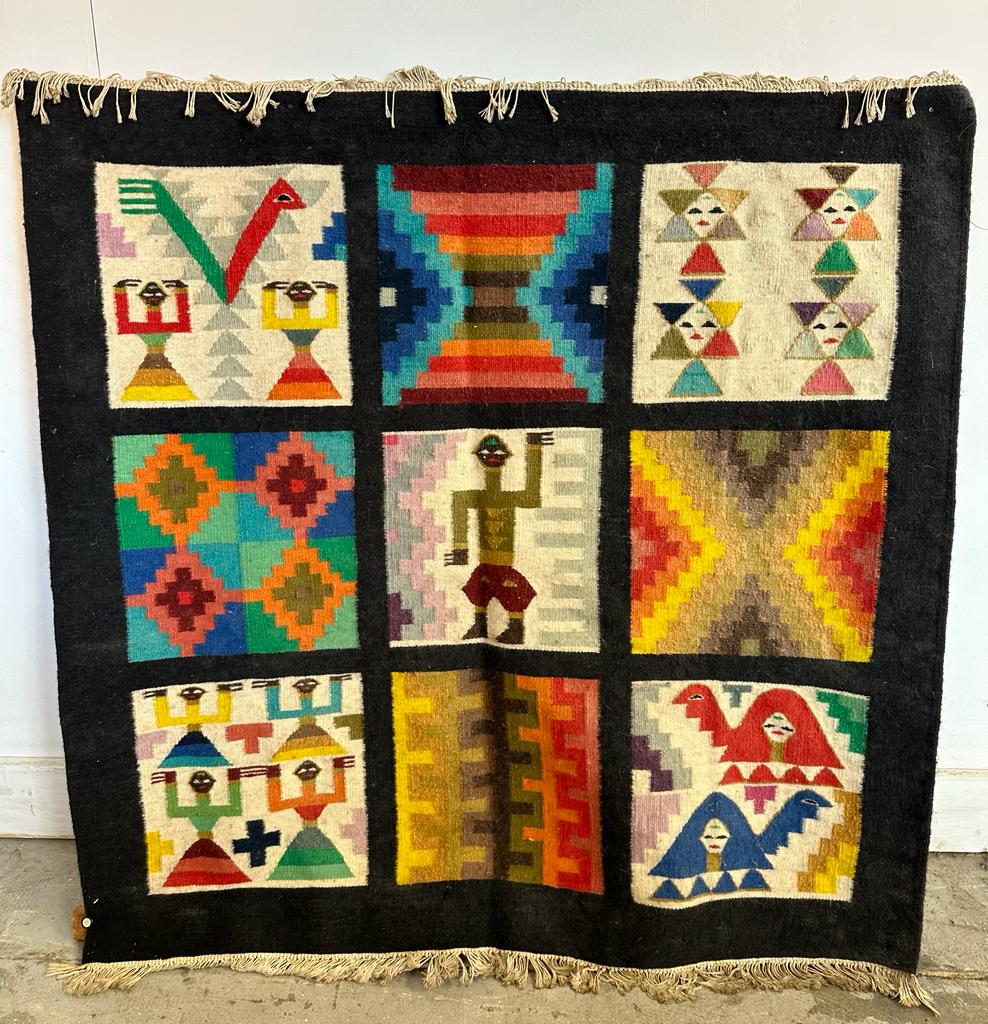 An Aztec style wall hanging on a wooden frame 95cm x 95cm