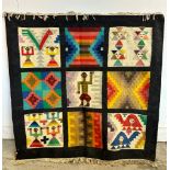 An Aztec style wall hanging on a wooden frame 95cm x 95cm