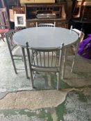 A grey circular extendable dining table and four chairs (Dia110cm)