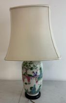 A Japanese ceramic vase table lamp decorated with Geisha girls and cherry blossom trees