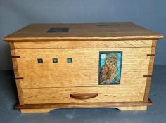 An oak two tier and single drawer jewellery box with owl detail