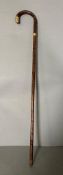 A vintage bamboo walking cane with 18ct rolled hold handle tip