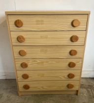 A six long drawer veneered chest of drawers with circular pine handles AF