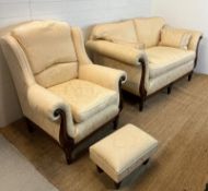 Two seater sofa with scrolling wooden frame and matching chair and footstool by Medallion (H83cm