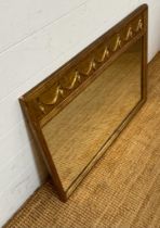 A regency style gilt over mantle mirror with swag detail