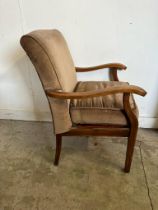 A Mid Century open arm chairs upholstered in brown