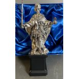 A silver figure of Henry VI, founder of Eton college and a representation of the statue in Eton