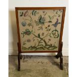 A fire screen with needlework to centre (H84cm E62cm)
