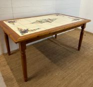 A pine tiled top kitchen table (H76cm W106cm D98cm)