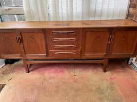 A G-Plan Mid Century sideboard comprising of four drawers to centre flanked by two cupboards