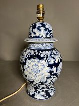 An Oriental style table lamp on wooden base H 46cm