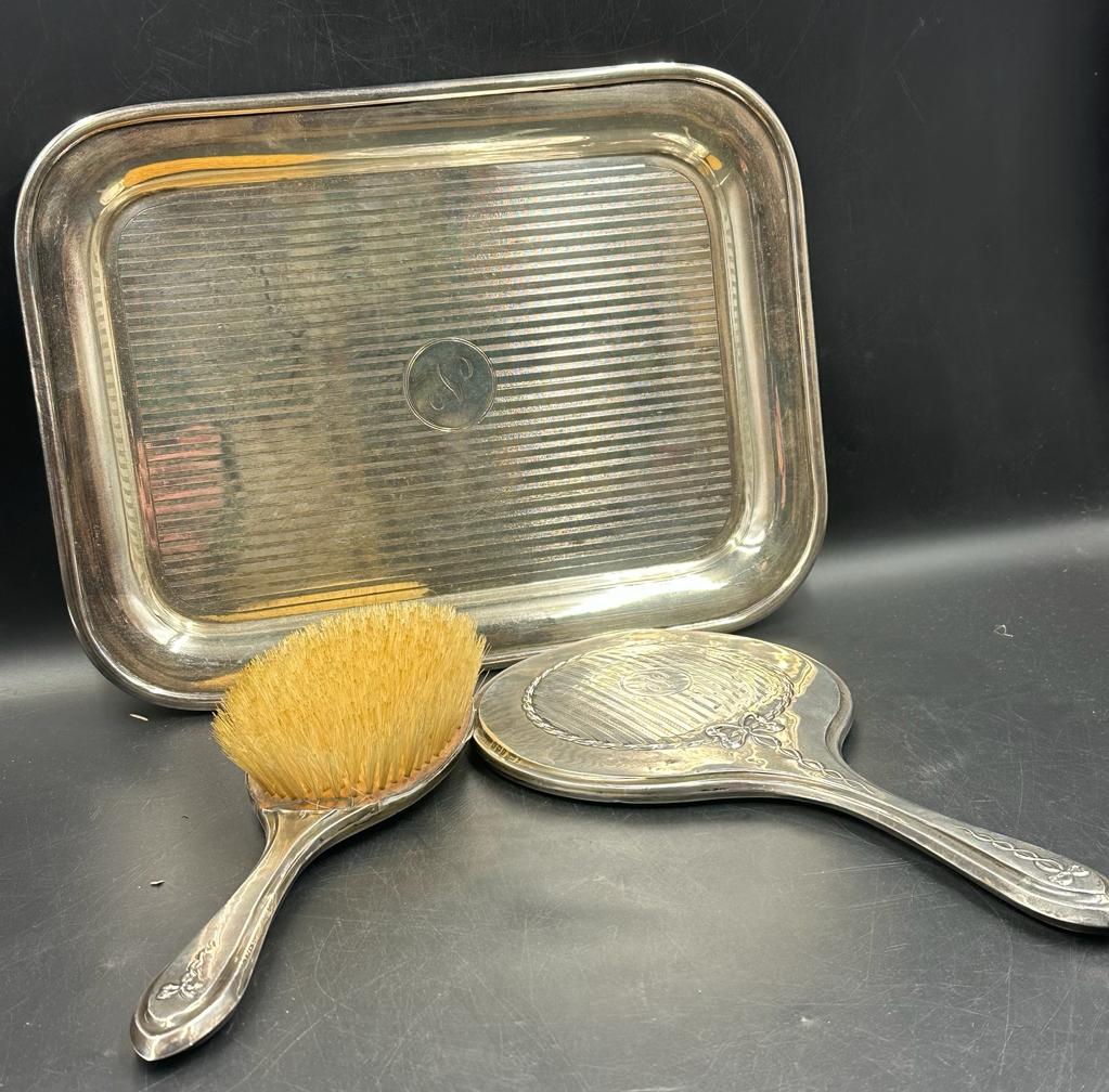 An early 20th Century two piece silver mounted dressing table set, hallmarked Birmingham and a