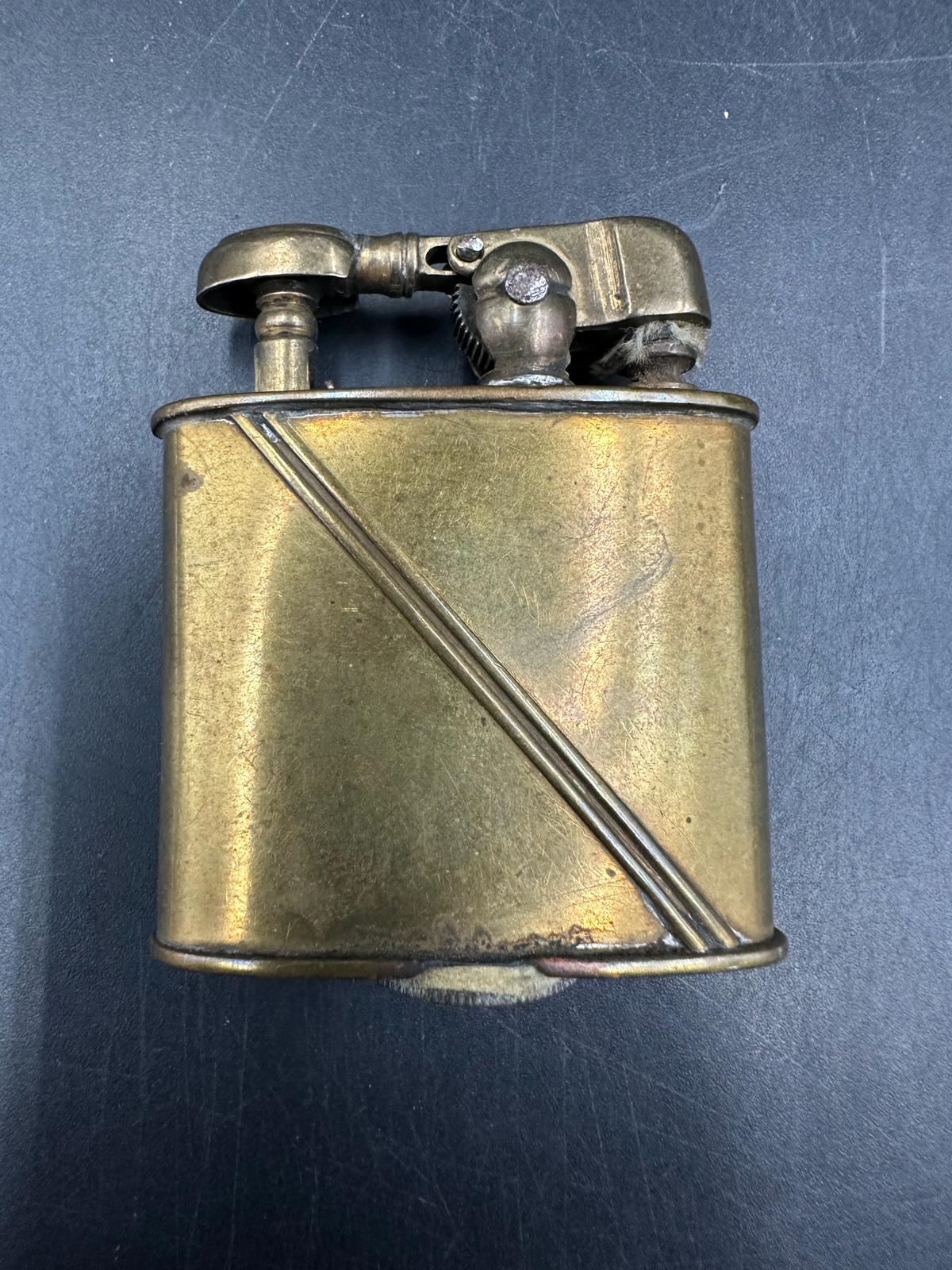 A pre war Dainty lighter in pen form and an unmarked brass lighter - Image 3 of 3