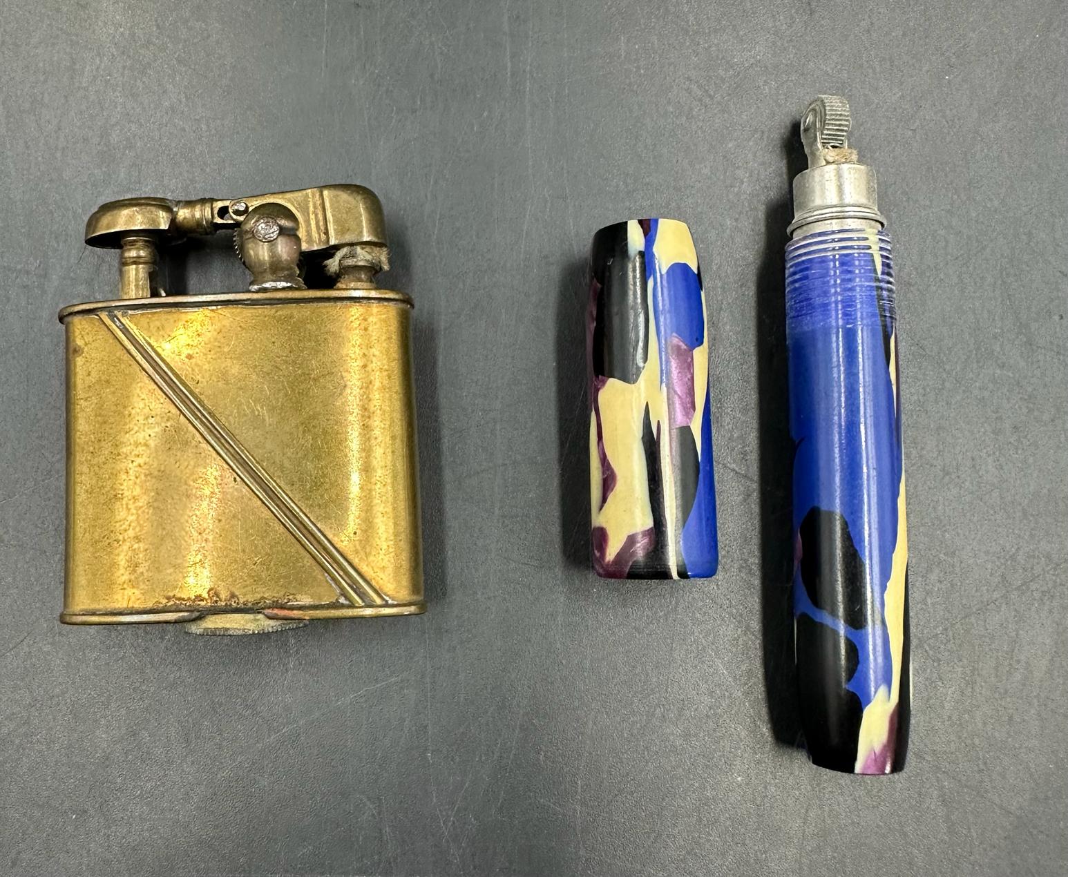 A pre war Dainty lighter in pen form and an unmarked brass lighter