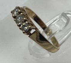 A 9ct gold and three stone diamond ring, marked 375, size J 1/2