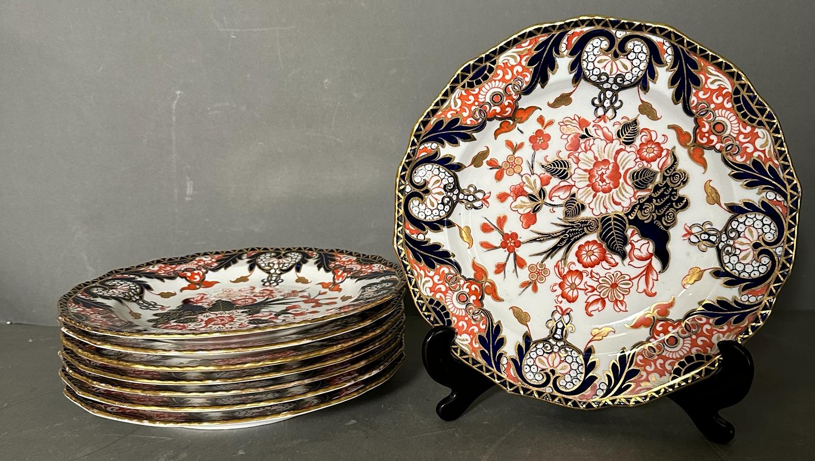 A set of eight Royal Crown Derby side plates