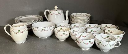 A part Crown Staffordshire pink rose tea service to include side plates, cups and saucers and a