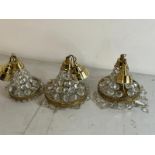 Three Empire style chandelier with brass frame and crystal glass