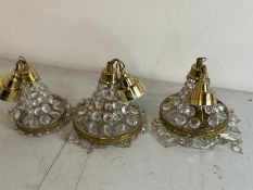 Three Empire style chandelier with brass frame and crystal glass