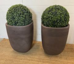 A pair of faux garden box hedge topiary balls in planters (H78cm)