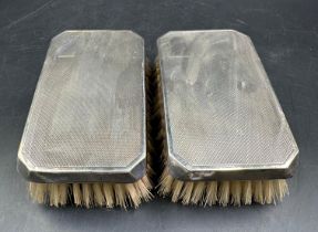 A pair of silver backed brushes, hallmarked for Birmingham by Daniel Manufacturing Company, 1957.