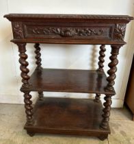 An oak late Victorian buffet, two shelves on barley twist support with a single carved fronted