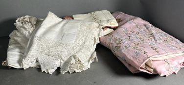 A selection of vintage linens, various patterns and styles.