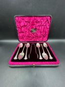 A cased box of six silver teaspoons and sugar nips, hallmarked for Sheffield 1902 by Mappin & Webb