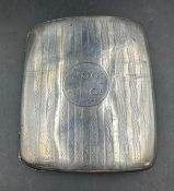 A silver cigarette case, hallmarked for Birmingham, makers mark JW.