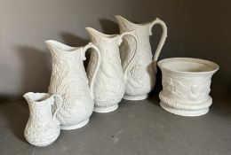 Four graduating Portmeirion British heritage collection jugs and a planter