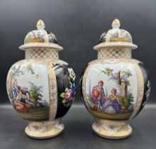 Two German Helena Wolfson urn vases, with green pastoral and floral scenes and gilded accounts