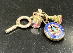 An 18ct gold pocket watch AF along with key, two stamps and and enamel locket